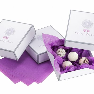 Individual cardboard boxes for wellness products like bath balls